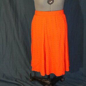 bright red skirt with flowers